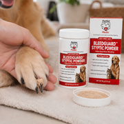 A person gently holds a golden retriever's paw treated with PetVet Bleedguard styptic powder, alongside the product's container and packaging.