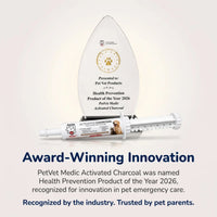 A tear-shaped award for PetVet Medic Activated Charcoal sits behind a pet emergency care syringe labeled as the 2026 Health Prevention Product of the Year.