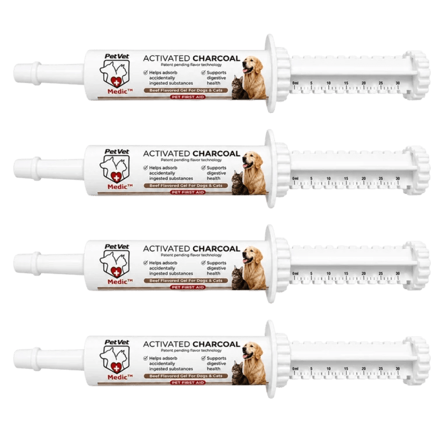 Four identical PetVet Medic activated charcoal pet first aid gel syringes are displayed horizontally against a white background.